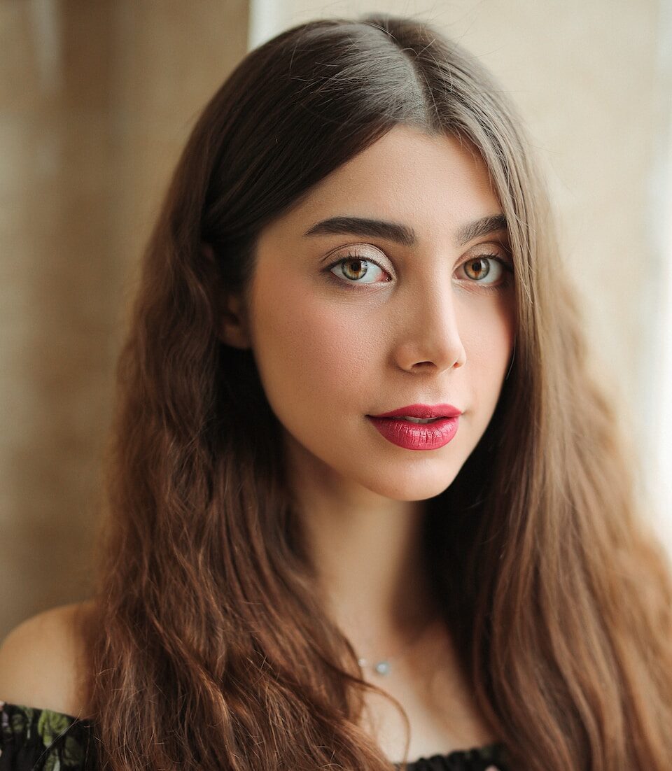 woman in green and black sleeveless top